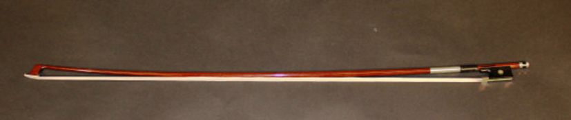 A violin bow by D. Carvalho Brazil, 74.6 cm.   CONDITION REPORTS  Has general wear conducive with