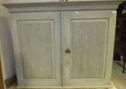 A green painted dresser top with reeded panelled cupboard doors