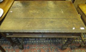 A Victorian oak single drawer side table in the 17th Century manner, raised on barley-twist