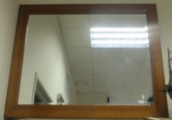 A pine framed rectangular bevel edged wall mirror