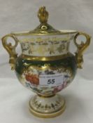 A Continental porcelain pot pourri vase and cover with gilt decorated dolphin handles and the