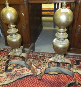 A pair of large 19th Century polished steel and brass fire dogs