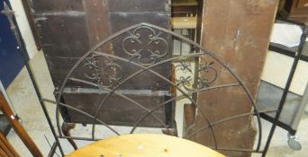 A black painted metal bed frame with Gothic arch ends (no bolts)