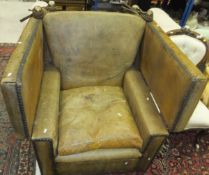 A leather upholstered Knole armchair with stud decoration