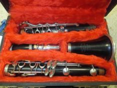 An F. Buisson clarinet, housed in a black carrying case