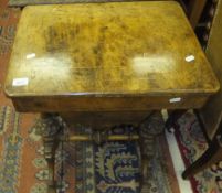 A Victorian walnut and inlaid sewing table, the rising top opening to reveal a basic fitted
