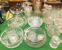 A collection of assorted clear glassware to include heavy bowl with square foot, assorted decanters,