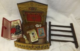 A bakelite and transfer print decorated toy theatre, titled "Pollock's Theatre" (incomplete),