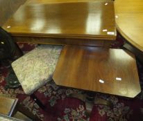 An Edwardian mahogany and satinwood strung fold-over tea table on square tapering legs, a mahogany