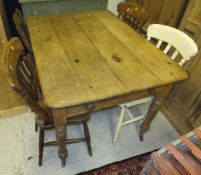 A Victorian pine farmhouse kitchen table with end drawer on turned legs to castors, four assorted