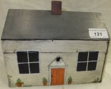 A lidded box painted as a cottage