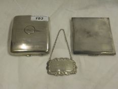 Two silver cigarette cases, together with a silver wine label inscribed "Sherry"