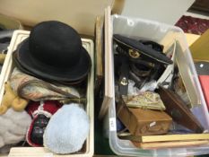 Two boxes of miscellaneous items to include a black bowler hat, two felt hats, a Russian cap, a