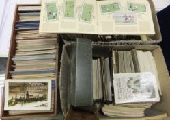 A large selection of Wills Cigarette Card albums, and two boxes of assorted postcards   CONDITION