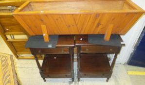 A pair of two tier mahogany bedside tables with two single drawers on turned supports, together with