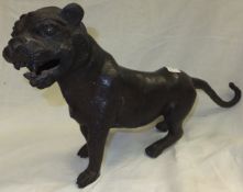 A Chinese hollow chocolate patinated bronze tiger figure
