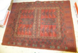 A Caucasian rug, the red centre field with bar decoration and geometric patterns in black and cream,