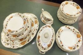 A collection of Wedgwood "Begonia" pattern pottery table wares to include platters, plates, gravy