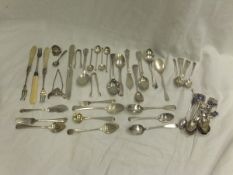 A collection of silver cutlery to include a set of six silver teaspoons, various silver souvenir