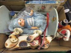 A box containing a small collection of vintage toys to include a pale blue painted doll's crib, a