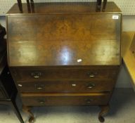 A walnut bedside cabinet with single drawer above cupboard door to cabriole legs, two mahogany