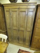 A Victorian pine kitchen cupboard with two slim doors enclosing shelving   CONDITION REPORTS  Approx