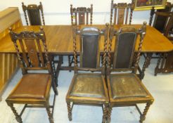 An oak table with barley-twist supports and stretchered base, together with a harlequin set of eight