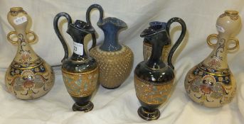 A pair of Royal Doulton stoneware amphora, No'd. 7068, a Royal Doulton stoneware amphora with