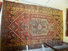 A Hamadan rug, the central grey / blue lozenge shaped medallion on a madder ground within a grey /