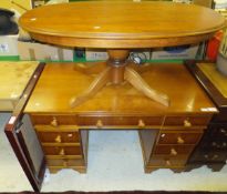 A modern veneered kneehole desk with turned knob handles, together with a similar oval coffee