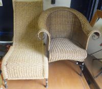 A modern wicker armchair with iron frame, together with an iron framed rush chair
