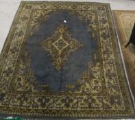 An Ushak carpet, the yellow, blue and cream diamond shaped central medallion on a pale blue ground