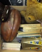 A box of miscellaneous items to include a bakelite Viewmaster, a vintage teddy bear, a leather rugby