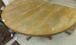 A modern circular pine kitchen table   CONDITION REPORTS  Top with havy wear, scuffs, some
