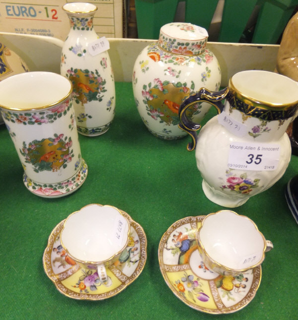 Three pieces of Royal Worcester "Old Worcester Parrot" pattern decorative wares to include two vases