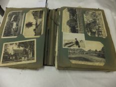 An early 20th Century postcard album containing various Continental topographical postcards