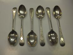 A set of six Edwardian silver engraved teaspoons (by Wakely and Wheeler, London, 1903)