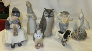 Four Royal Copenhagen porcelain figures to include "Seated girl", No'd. 1314, "Penguin", No'd. 1283,