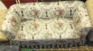 A late Victorian Chesterfield sofa with floral loose cover plus a mahogany bookcase and a gilt