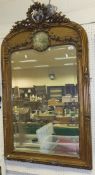 A Victorian giltwood and gesso framed overmantel mirror with floral and ribbon surmount