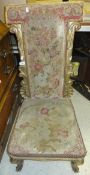 A Victorian giltwood framed prie à dieu chair with needlework upholstery