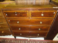 An Edwardian mahogany and inlaid chest of two short and three long graduated drawers