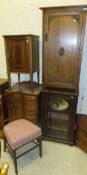 An Edwardian mahogany and inlaid pot cupboard and three various music cabinets, together with two
