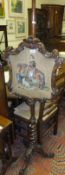 A Victorian walnut pole screen, the panel decorated in petit point needlework with figure on