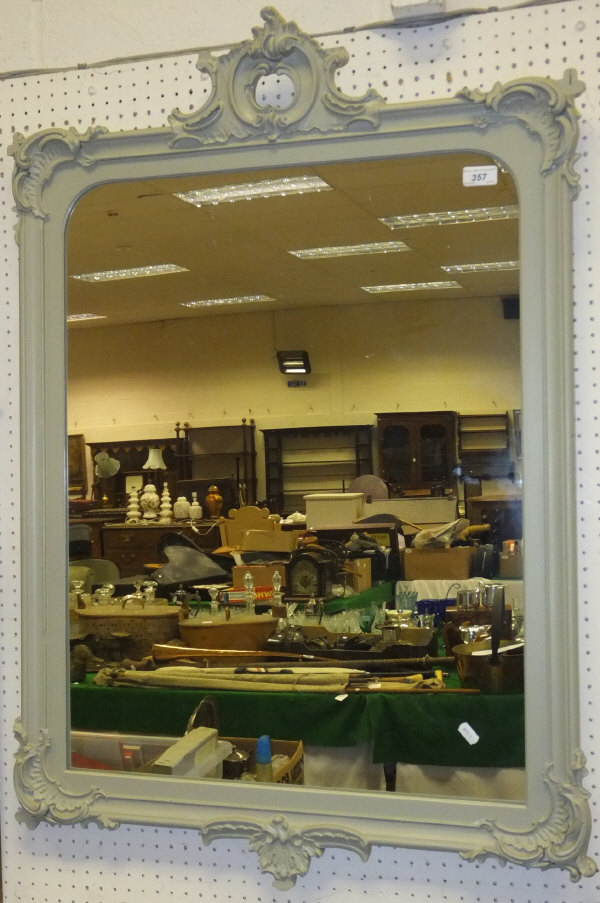 A grey / green painted rectangular wall mirror with a scrolling acanthus surmount   CONDITION