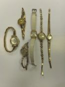 A collection of six various gold ladies wristwatches