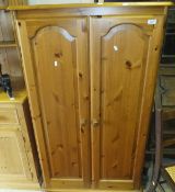 A low pine two door wardrobe