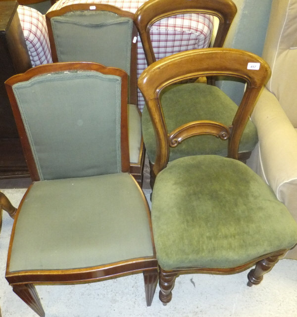 A pair of Victorian mahogany dining chairs, raised on turned and ringed legs, upholstered in a green