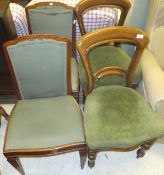 A pair of Victorian mahogany dining chairs, raised on turned and ringed legs, upholstered in a green