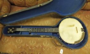 An Alfred Weaver 4½ string banjo, housed in a black carrying case   CONDITION REPORTS  Banjo has
